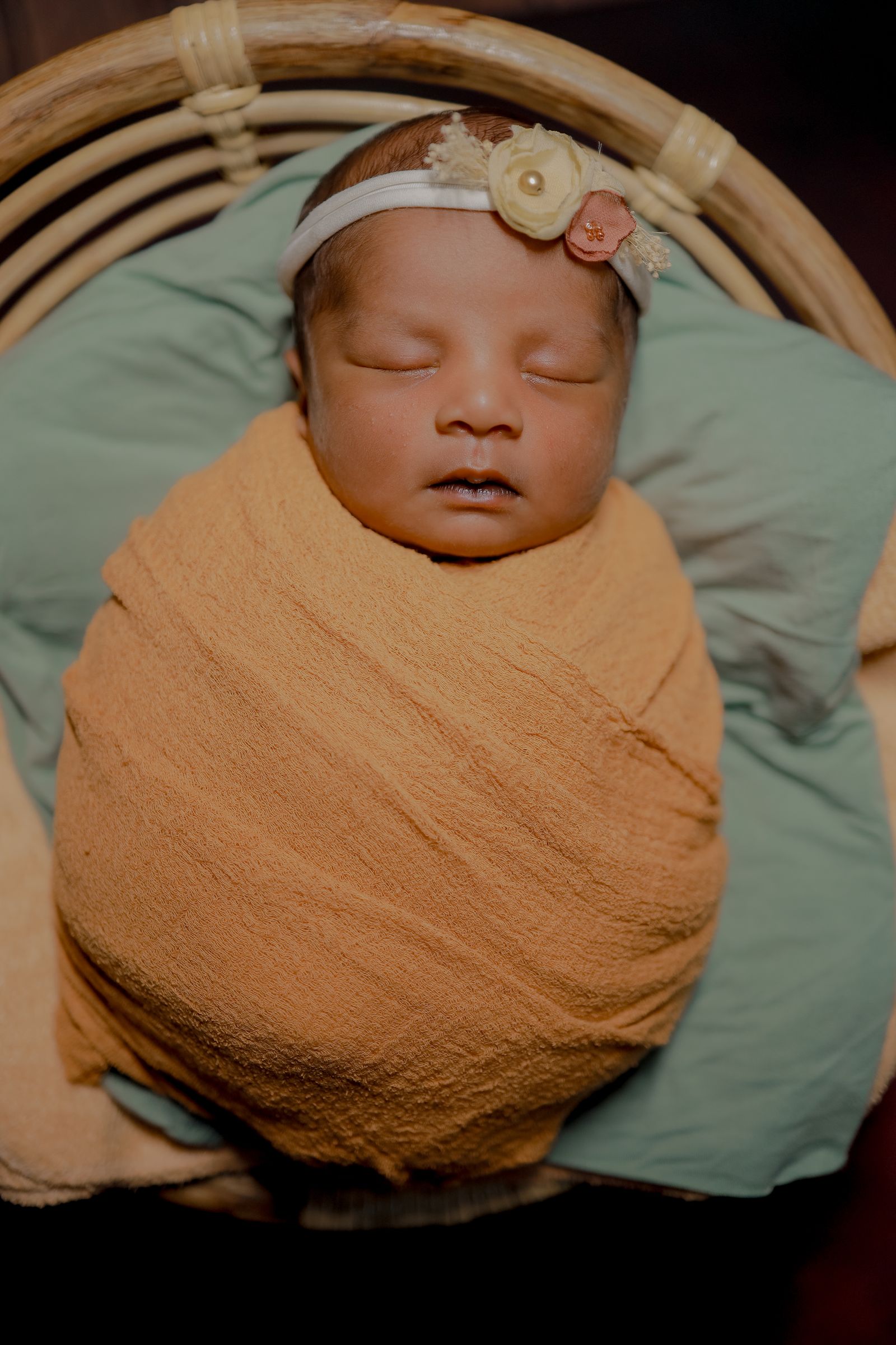 Peaceful newborn baby sleeping — infant care and fever awareness for parents
