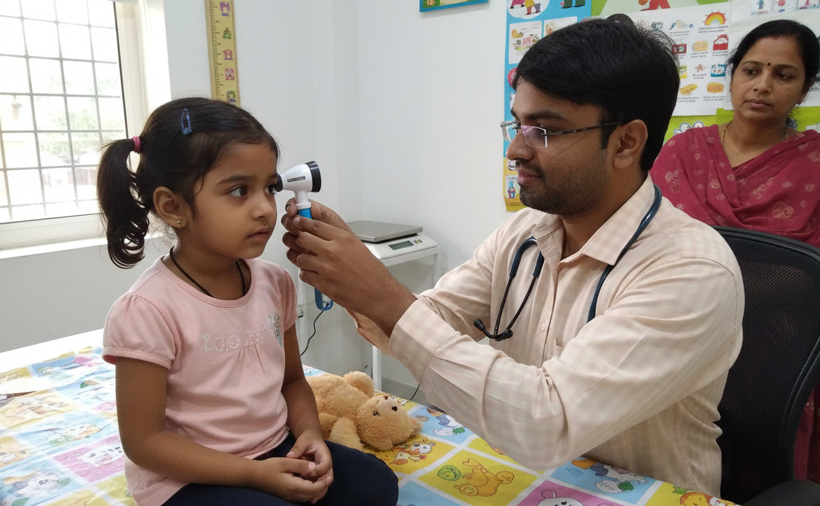 Best Pediatrician children specialist checking a child