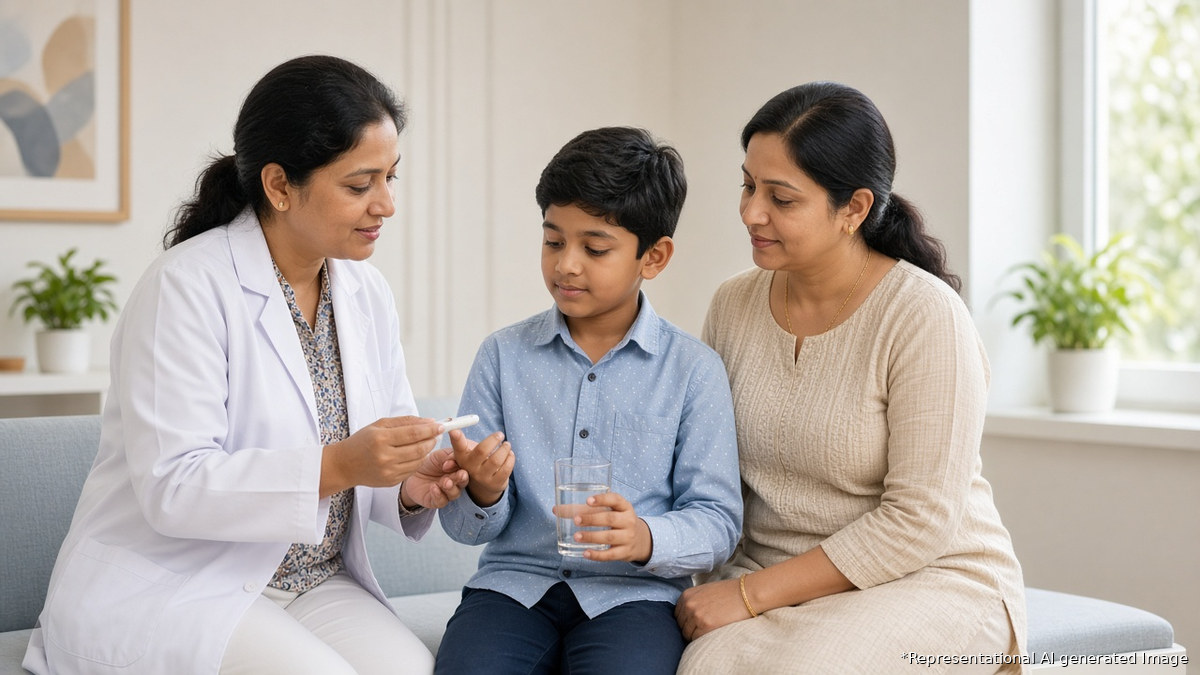 Indian pediatrician in a modern clinic doing a quick finger-prick blood glucose test on a thirsty school-age boy holding a glass of water, with his mother beside him, representational AI-generated image for an article on early signs of type 1 diabetes in children
